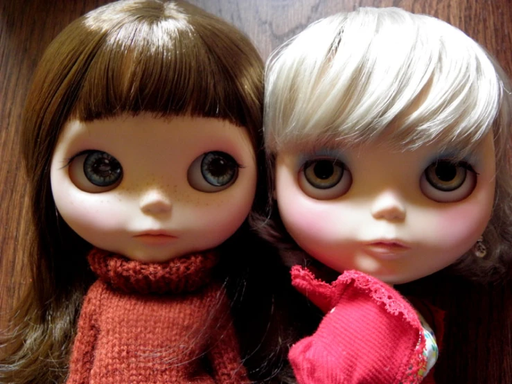 the two dolls are wearing identical outfits together