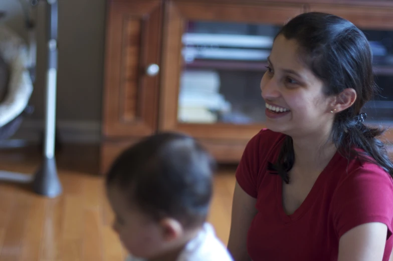 woman with a young child in a living room