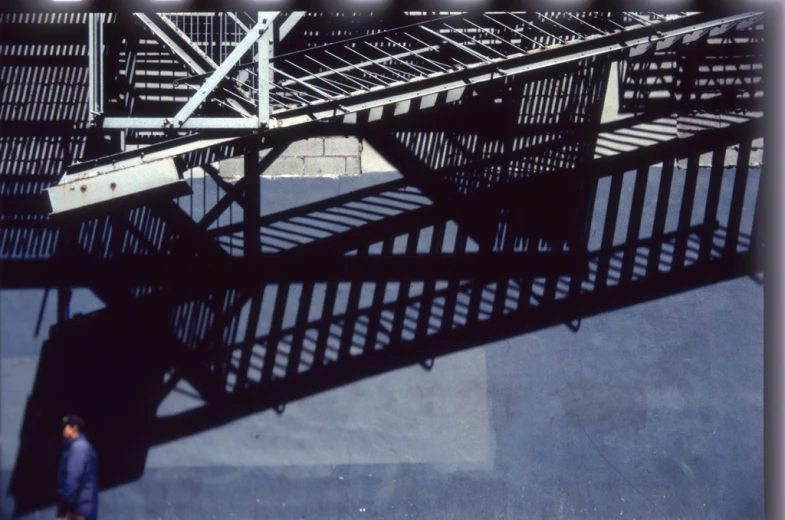 a man walking up to a stair case