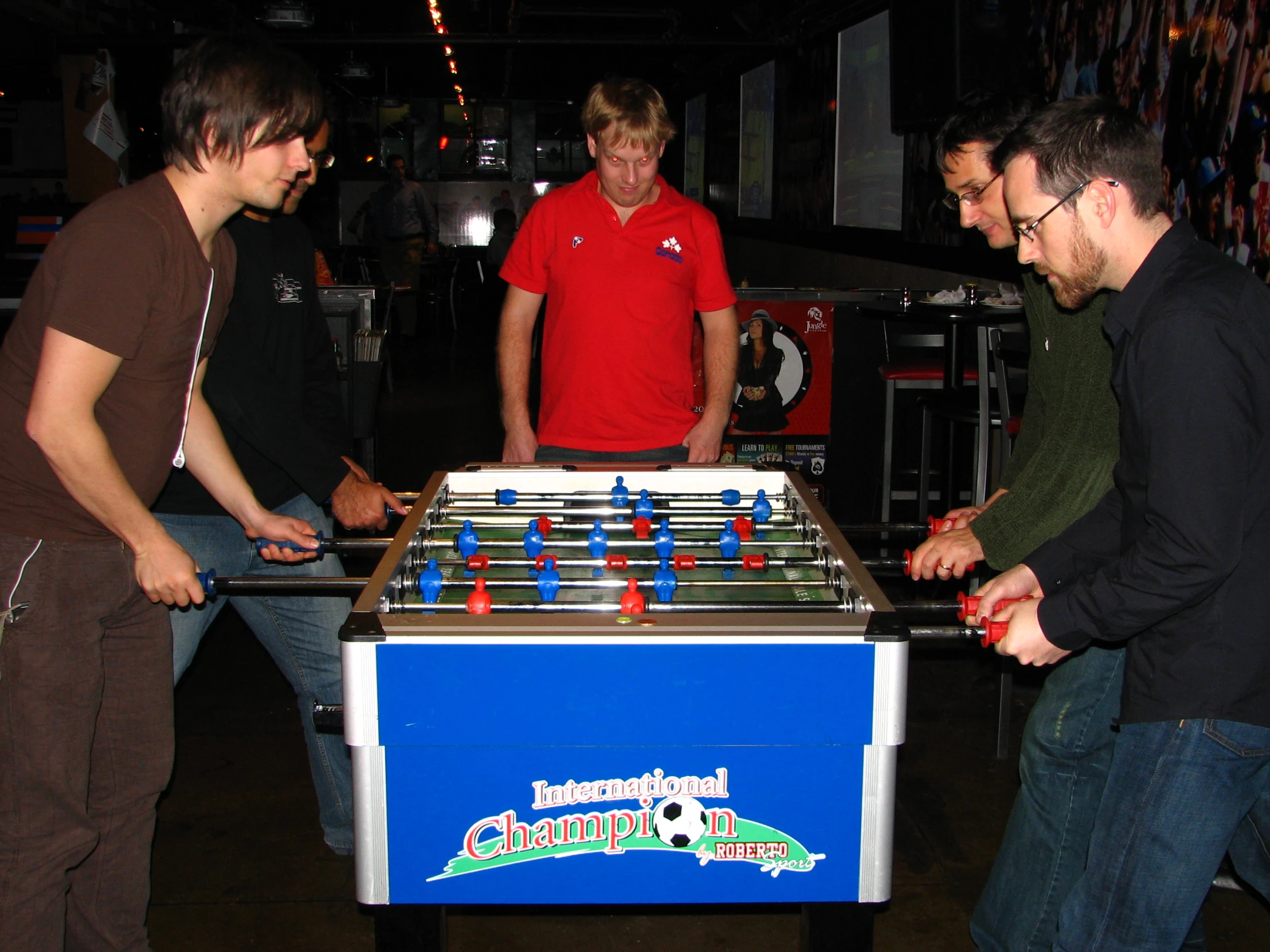 a group of men play foo - o - lites in a room