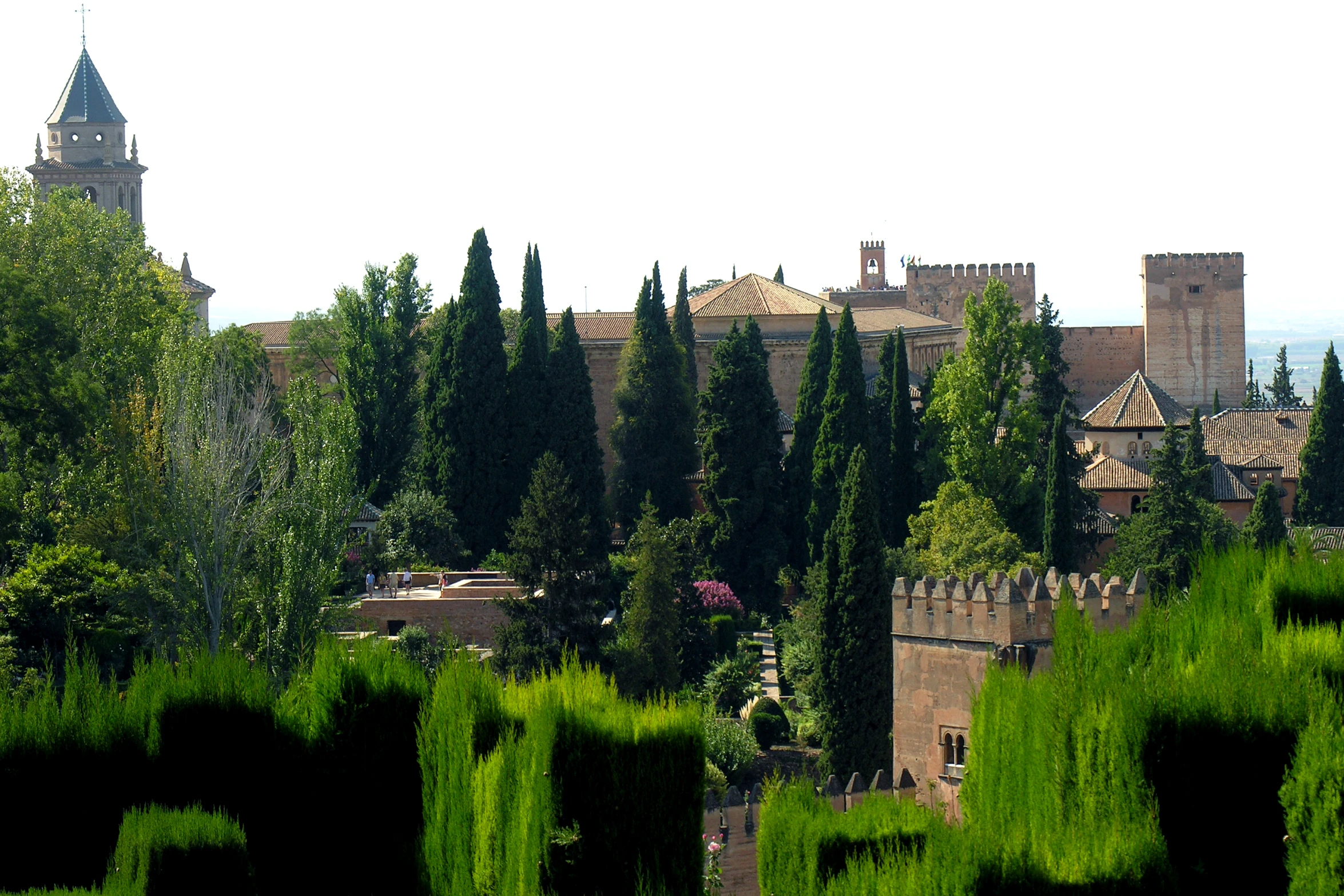 view of a beautiful castle with many green trees