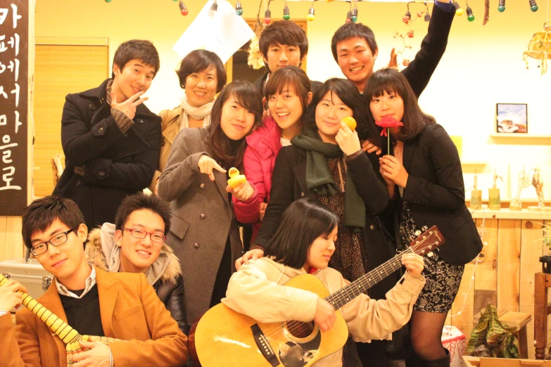 a group of people stand next to each other posing for a picture