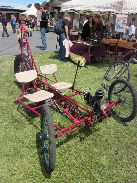 a small pedal car is parked on grass