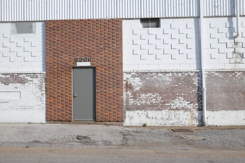 there is a stop sign next to an old building