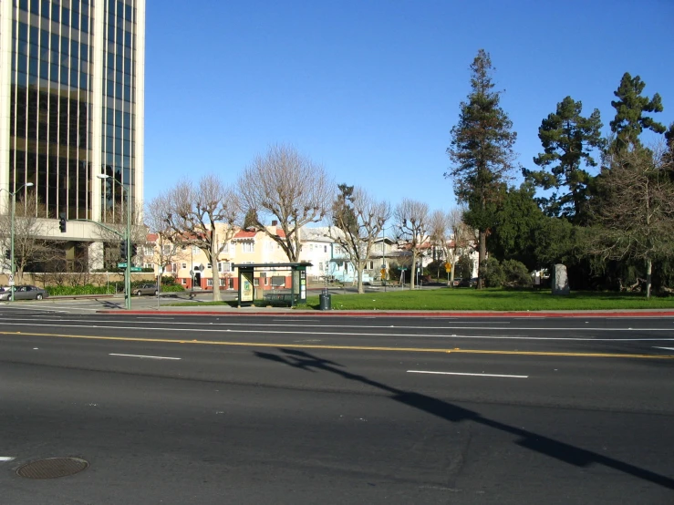 a street view showing one way and houses