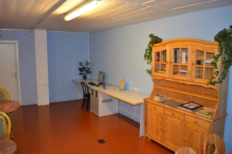 a desk and chair in a small room