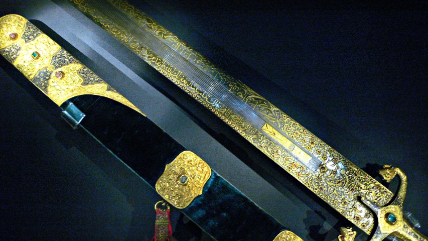 the bottom half of a large wooden sword on display