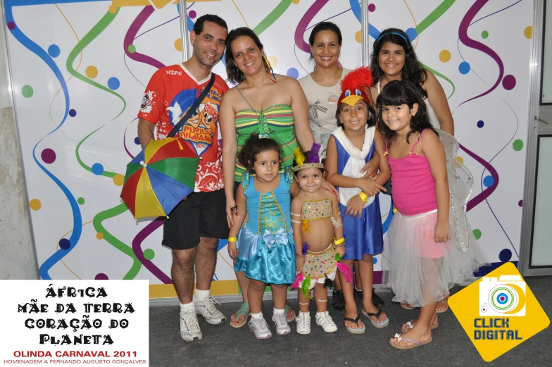 a group of young children posing for the camera