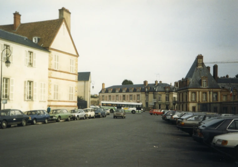 cars parked along the curb in front of a building