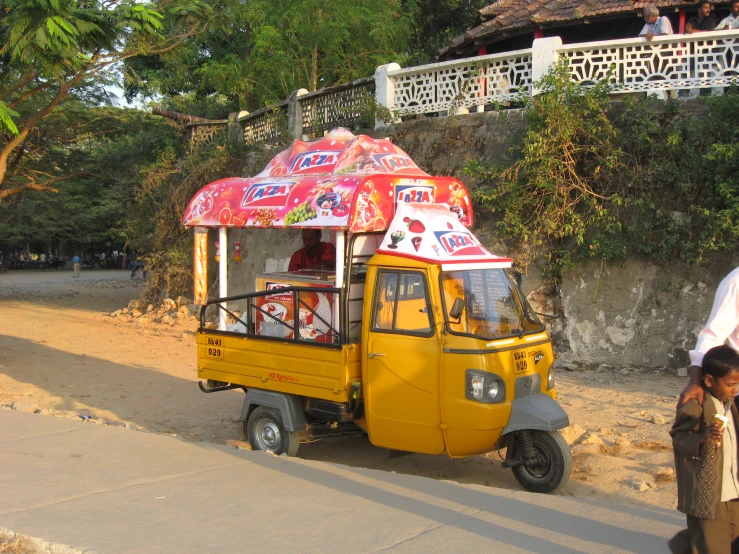 small food cart with roof that looks like a cart