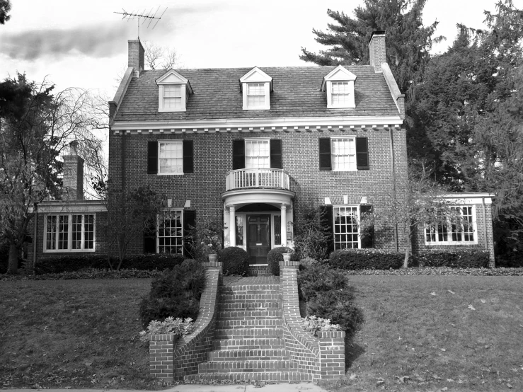 black and white pograph of a very nice looking house