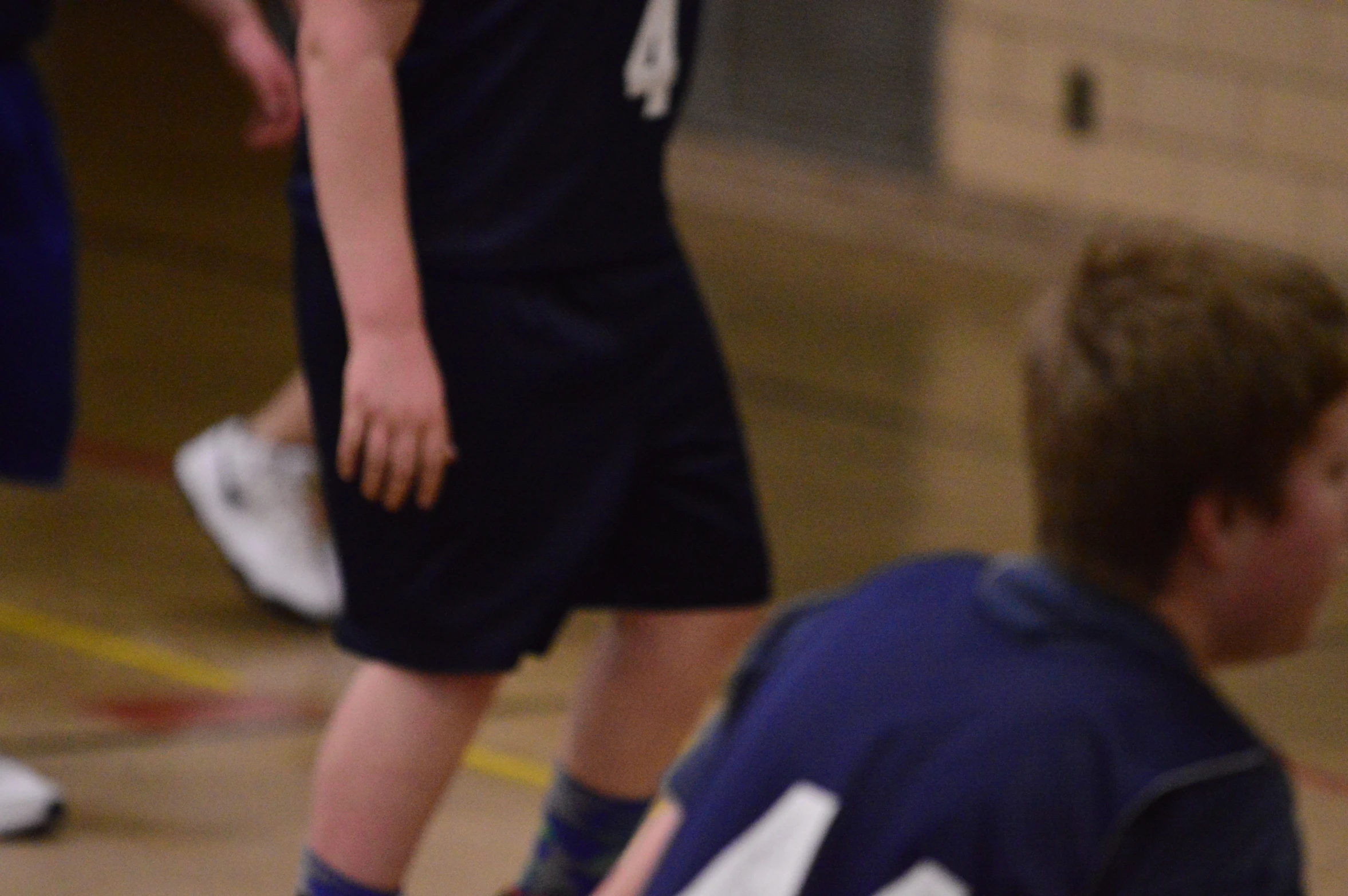 the men are playing basketball with their team