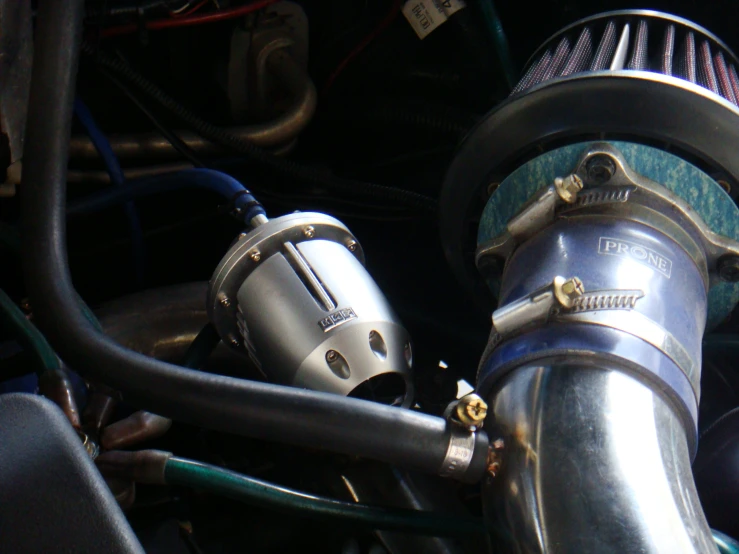 close up view of turbo - into - exhaust pipe and intake inlet