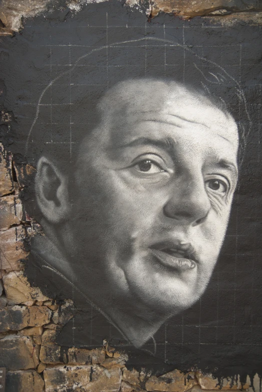 an image of martin marx painted on a brick wall