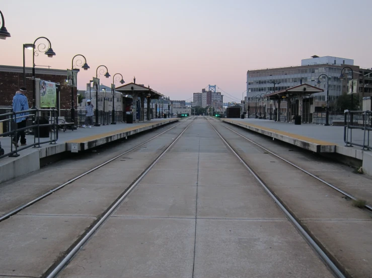 several train tracks in front of a building