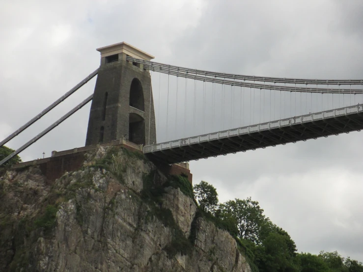 a long suspension bridge crossing over the cliffs