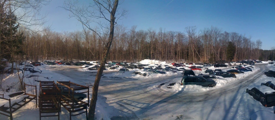 cars parked at an outdoor facility on a snowy day