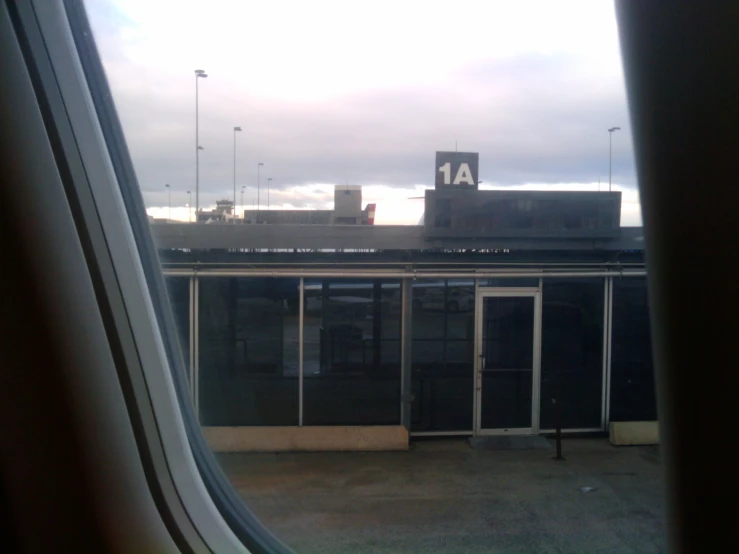 a building and door in a window overlooking an airport