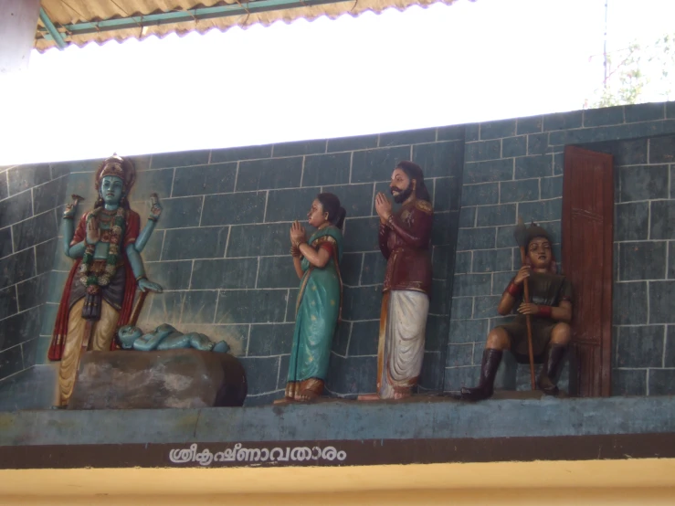 an image of some statues on the wall