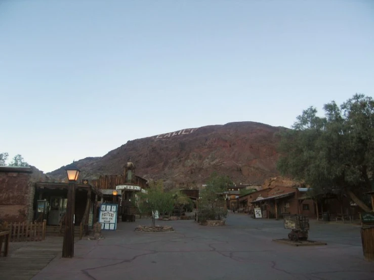 an empty city square and mountains in the background