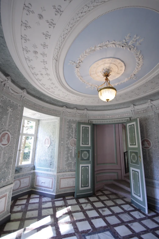 an intricately decorated and painted bedroom in a victorian mansion