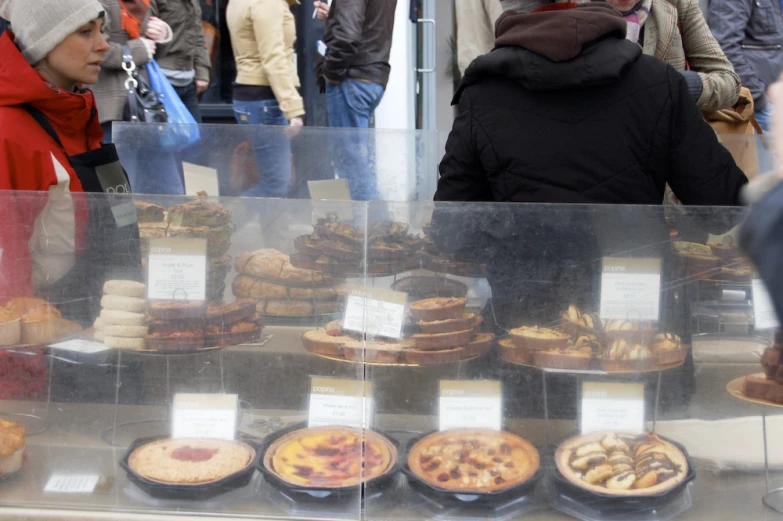 a glass display case full of various pastries