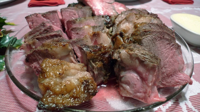 several different types of meat sitting on a plate