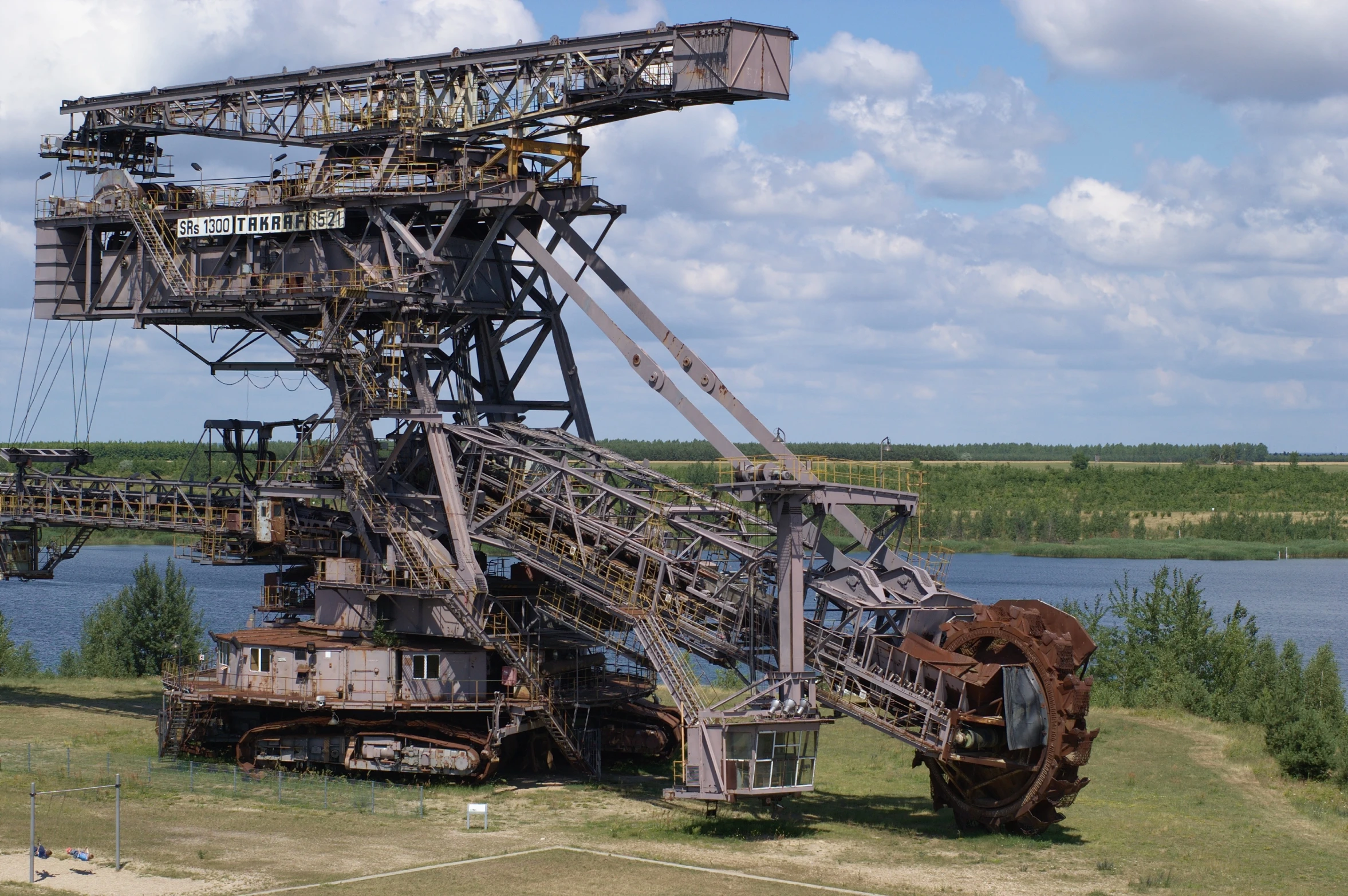 several pieces of machinery in front of water