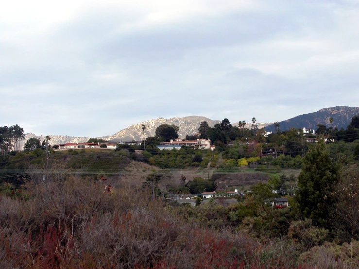 a mountain range with houses in the distance