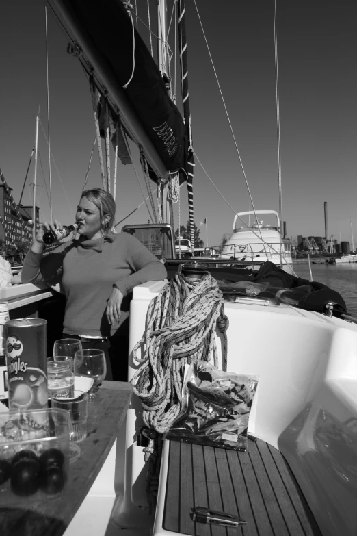 a man and woman standing on the deck of a boat