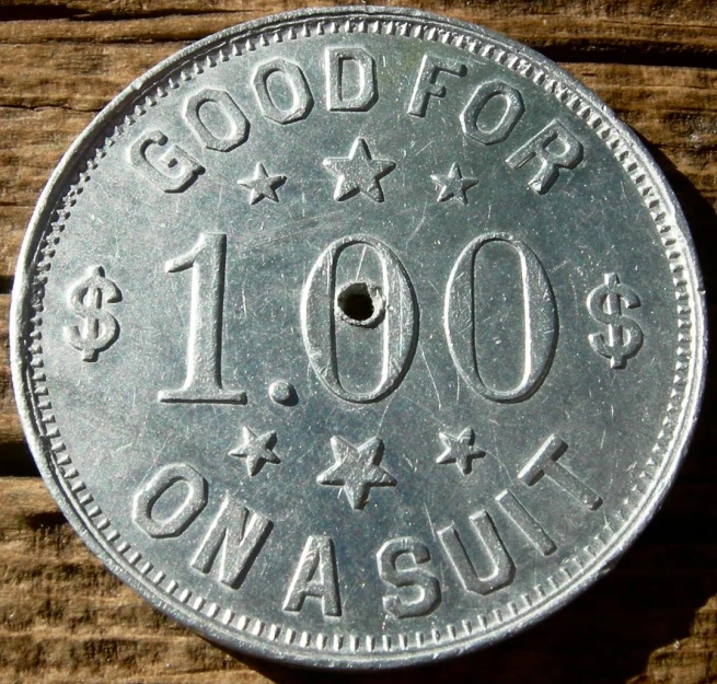 a close up of a silver colored coin