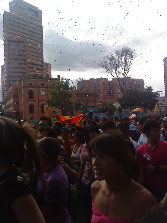 large crowd with many people in a city