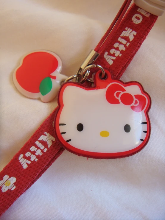 a hello kitty themed hello kitty collar lanyard keychain