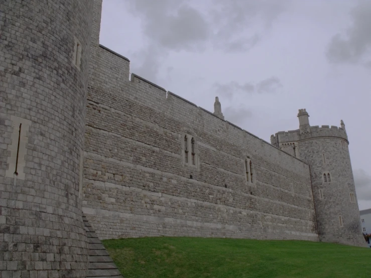 the wall and gate of a brick castle