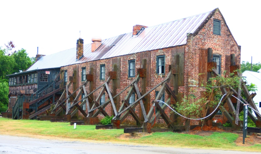 a very old building with some big wooden stairs in front of it