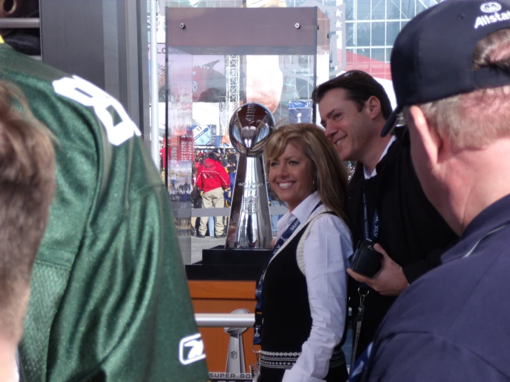 a group of people with many different trophies