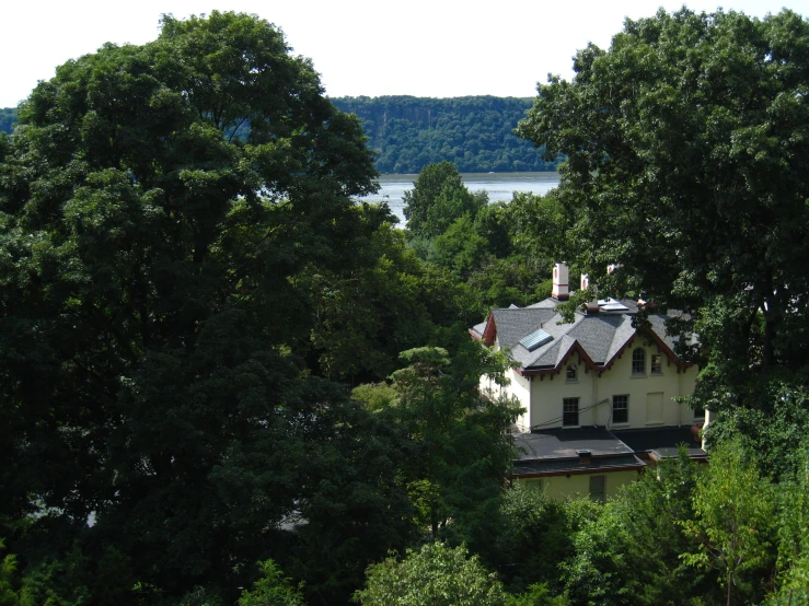 view from above of a house with trees surrounding