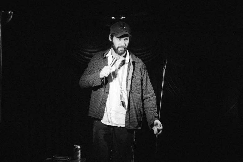 a man is dressed nicely with his hat and jacket