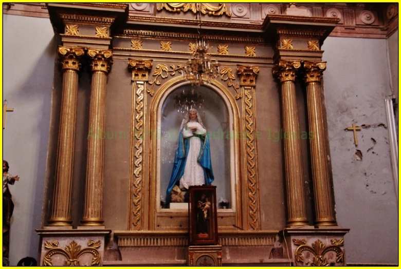 this is a statue in a gold framed church