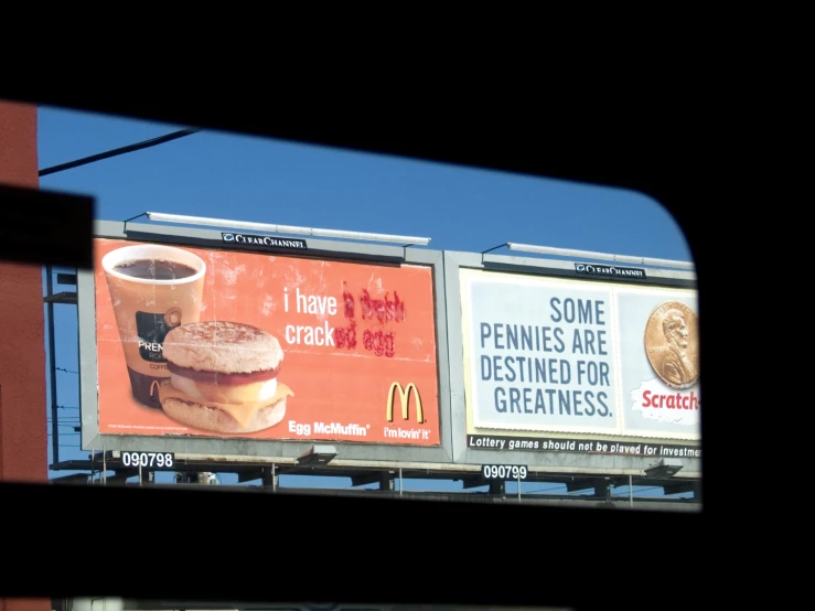 a billboard displaying a giant drink in the distance