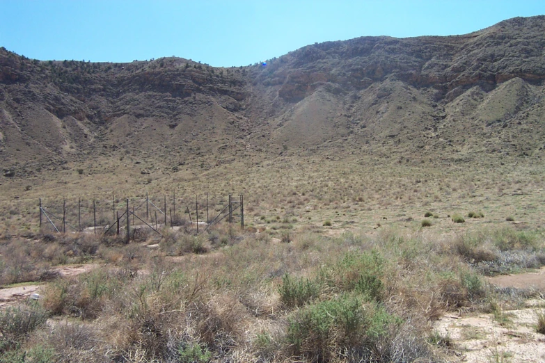 the desert with very steep hills and dry plants