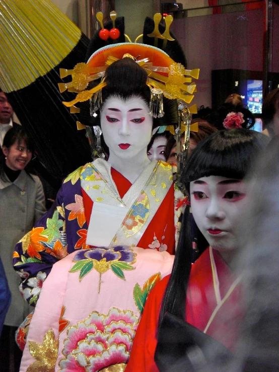 two performers in costume are standing next to each other
