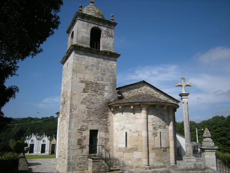 an old, run down, tower like building in a cemetery