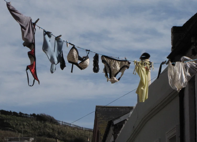 there are some clothes hanging up outside on the line