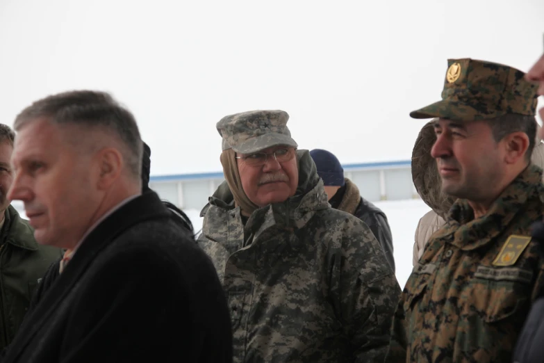 soldiers are standing next to each other in a group