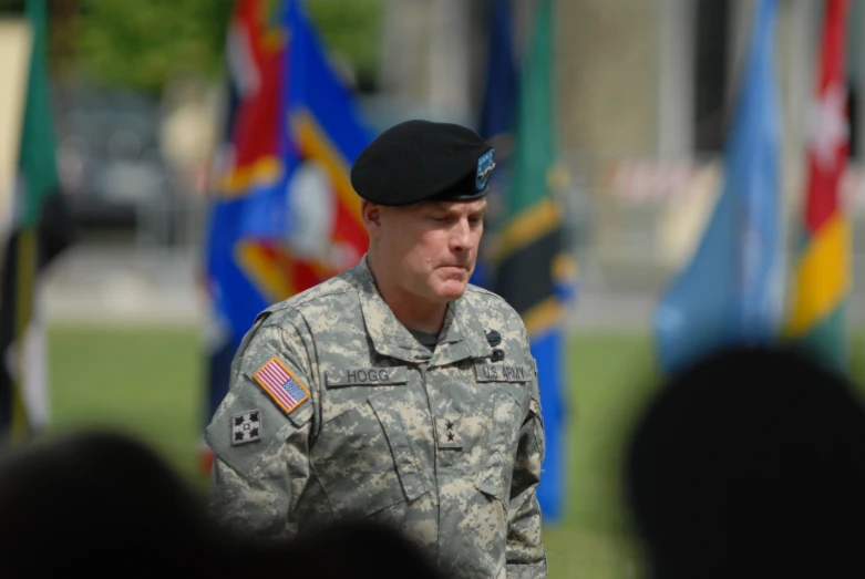 a man in uniform standing at a podium