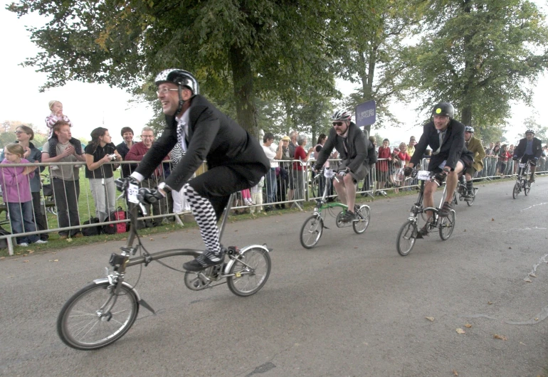 a bunch of people that are riding bikes