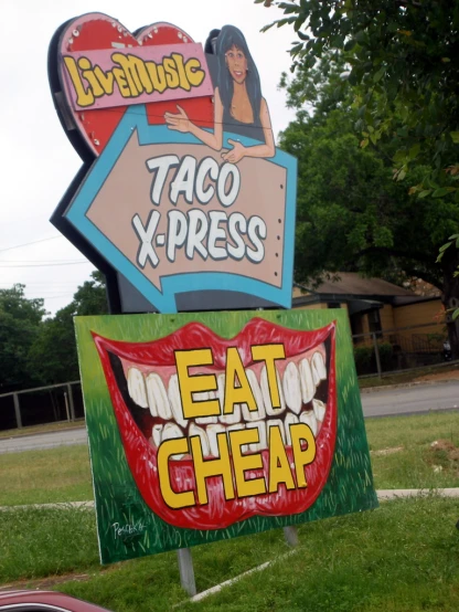 a neon sign outside of a taco and press store