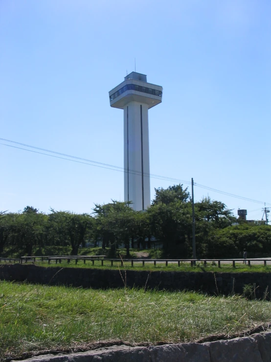 a large wind vane on top of a pole