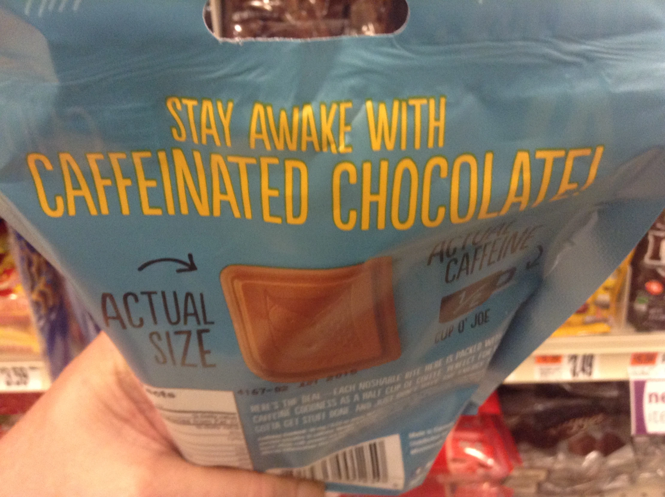 a bag of chocolate is held up in the store